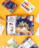 Essential-Themed Watercolor Coloring Club Box with watercolor markers, color swatches, and artistic supplies on yellow background