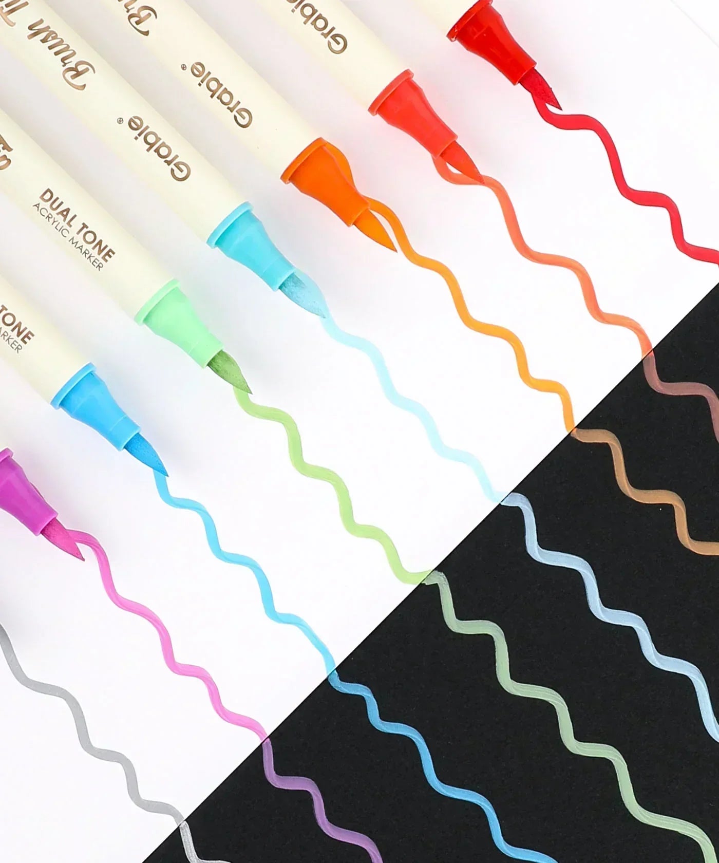 Dual Tone Brush Tip Acrylic Paint Marker Set With Coloring Book markers showing vibrant colors on black and white paper.