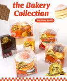 Grabie Ultimate Stress Relief Squishy bakery-themed slow-rising squishies in clear packaging with food designs