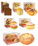 Grabie Ultimate Stress Relief Squishy set with chocolate bar, bread, croissant, burger, pancakes, and loaf designs in clear packaging
