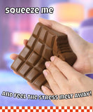 Grabie Ultimate Stress Relief Squishy in chocolate bar shape being squeezed by hands for stress relief