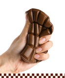 Hand squeezing brown Grabie Ultimate Stress Relief Squishy toy for stress relief and relaxation.