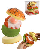 Grabie Ultimate Stress Relief Squishy shaped like a colorful teriyaki burger with hands squeezing it.