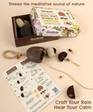 Create Your Own Rain Shell Shaker Kit with natural materials, beads, string, and instructional guide for a calming craft.