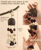 Create Your Own Rain Shell Shaker Kit hanging from a branch, showing natural pods and handcrafted details