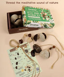 Create Your Own Rain Shell Shaker Kit with natural seeds, string, and instructions for making a meditative rain shaker instrument