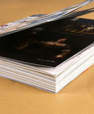 Thick open 200+ Pages Threads of Time Collage Activity Book showing vintage art prints on glossy pages