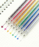 Capped Iridescent Glitter Gel Ink Pen Set Of 12 with vibrant glitter ink drawing colorful hearts on dotted paper.